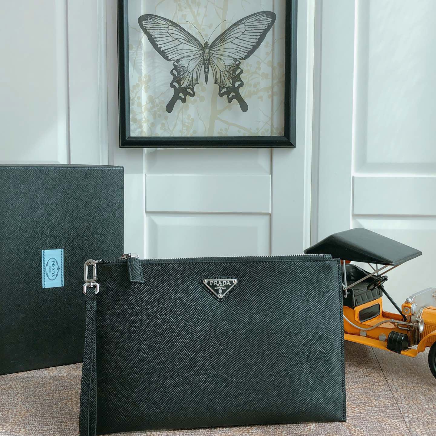 Pra*a clutch bags